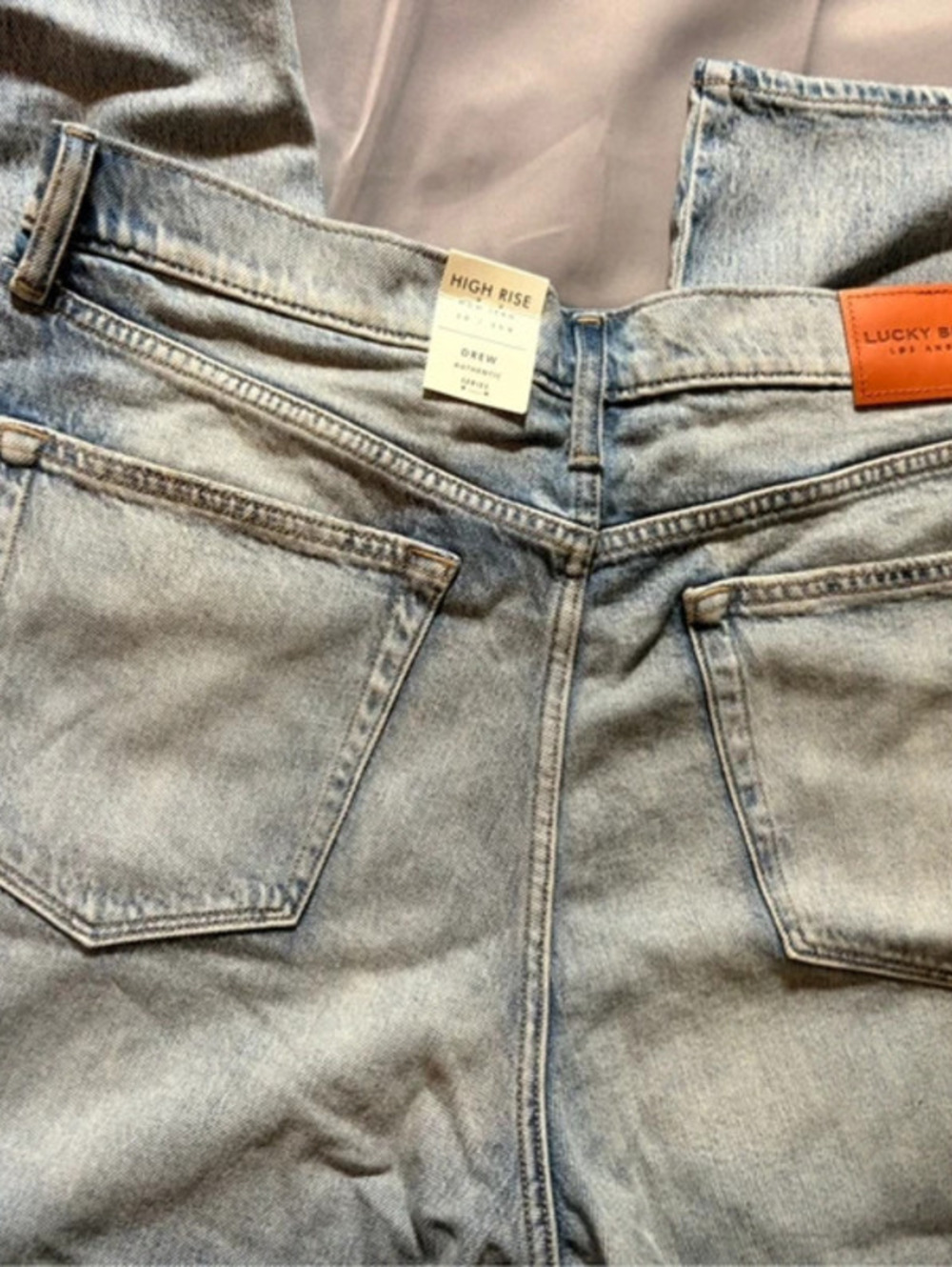 Lucky Brand high rise blue jeans with frayed knees
